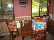 Josh and Em love "Walls" around their cereal bowls at breakfast, something to read.